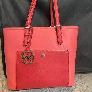 Two tone coral Michael Kors handbag.